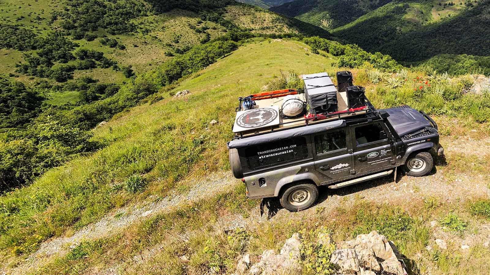 Land Rover exploring an off-road route into hills