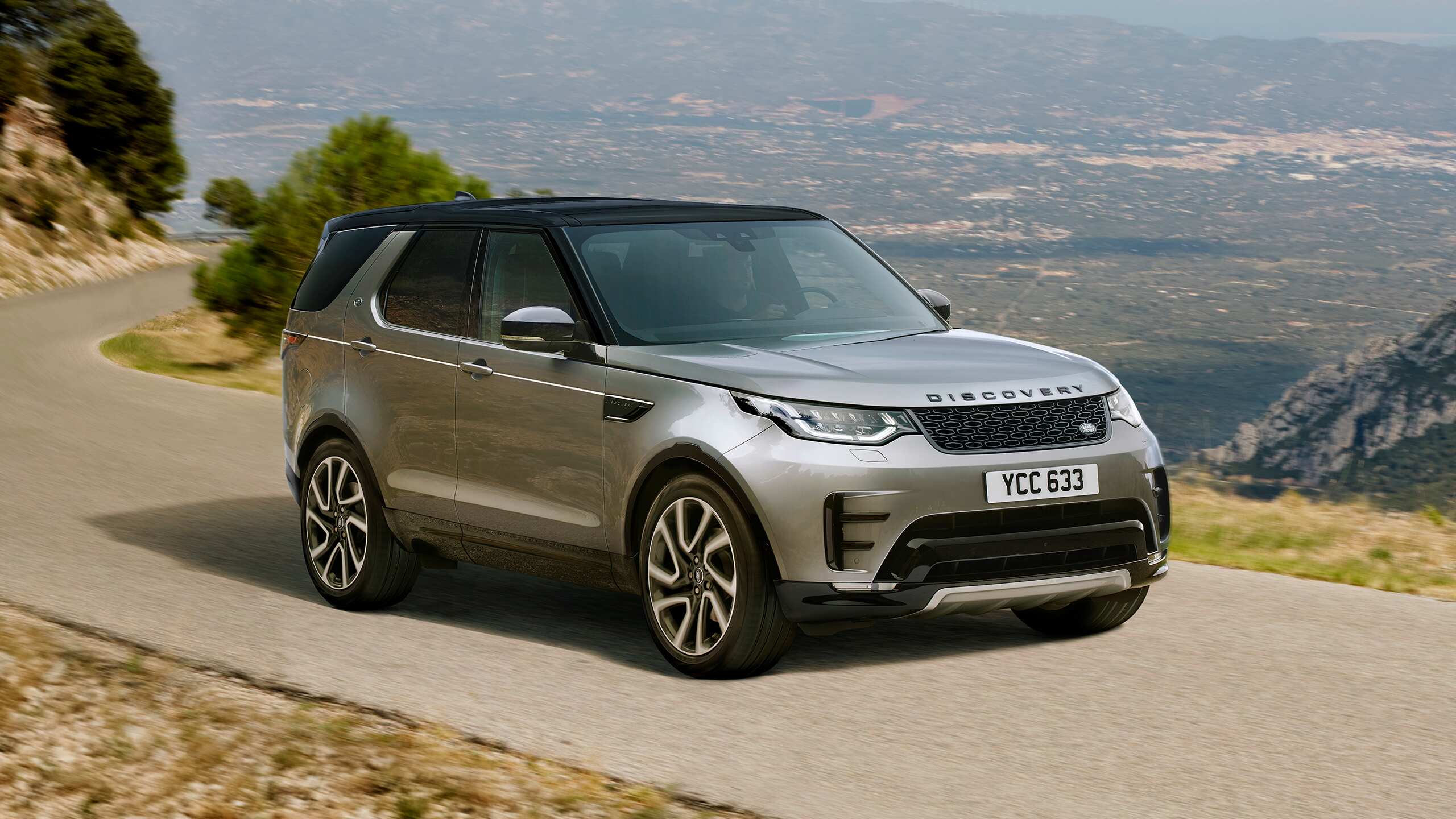 Land Rover Discovery Sport Parked at Hilly Terrain Road