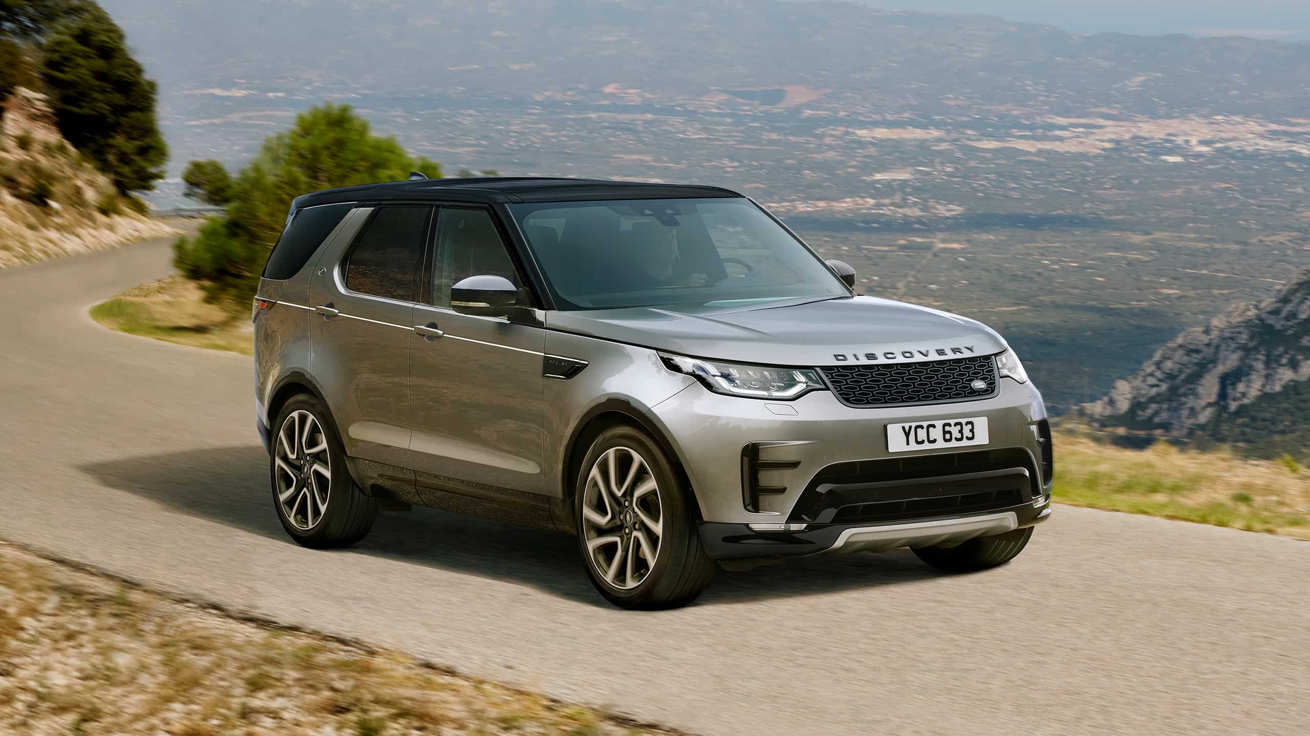 Land Rover Discovery Sport Parked at Hilly Terrain Road