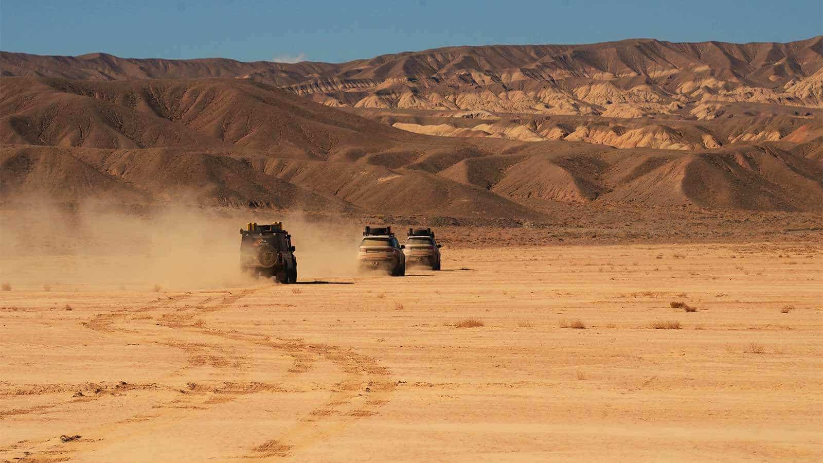 Range Rovers driving in the desert