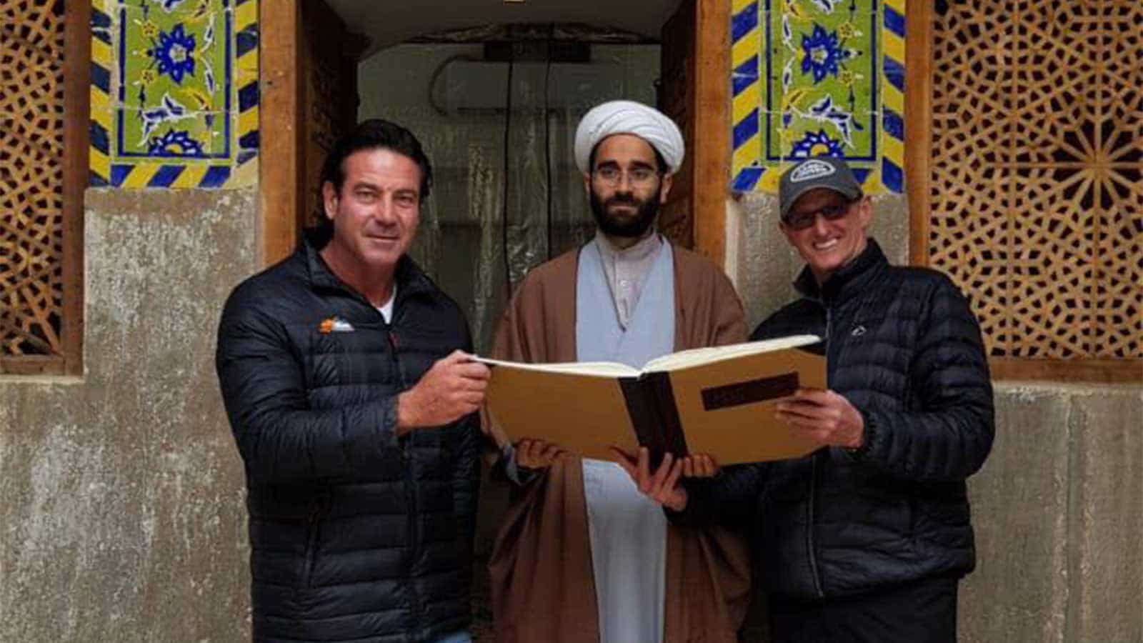 3 men reading